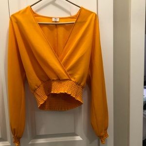 Cropped orange top from Aritzia